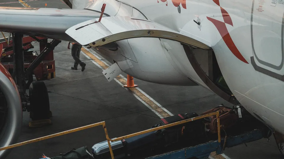 Travel luggage near an airport window